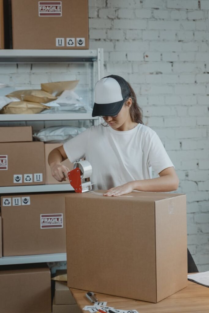 Woman in White Crew Neck T-shirt Holding White and Red Ceramic Mug